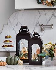 Brown lanterns with pumpkins and fairy lights