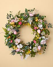 Closeup of a floral wreath on a yellow background