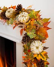 Artificial fall garland with pumpkins and pinecones