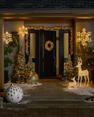 Holiday front door décor idea with silver and gold ornament wreaths and garlands