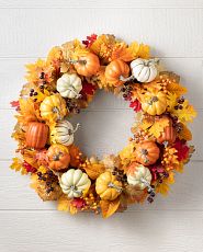 Wreath with fall foliage, pumpkins, and berries
